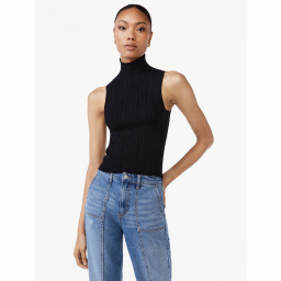 Woman wearing black sleeveless knit turtleneck
