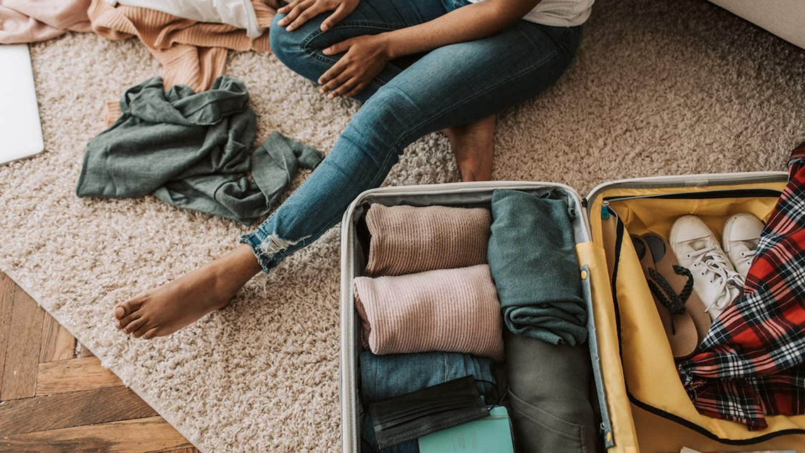 woman packing suitcase for vacation