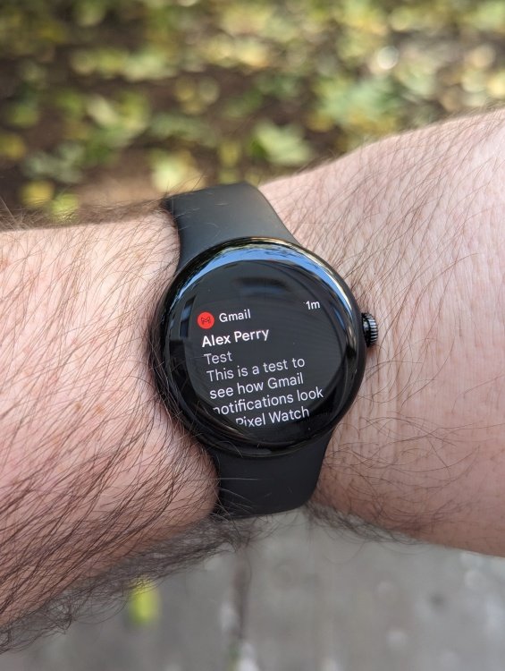 Pixel Watch on wrist with test email on screen