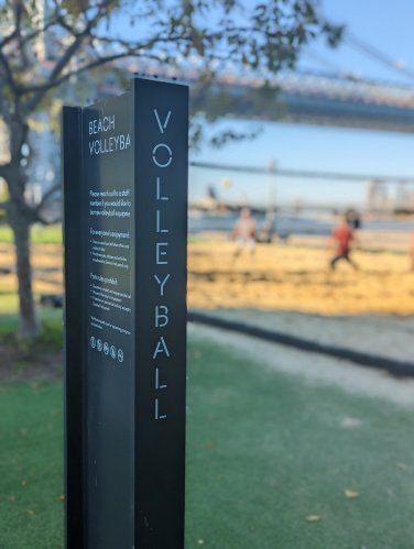 Beach volleyball sign at park in portrait mode