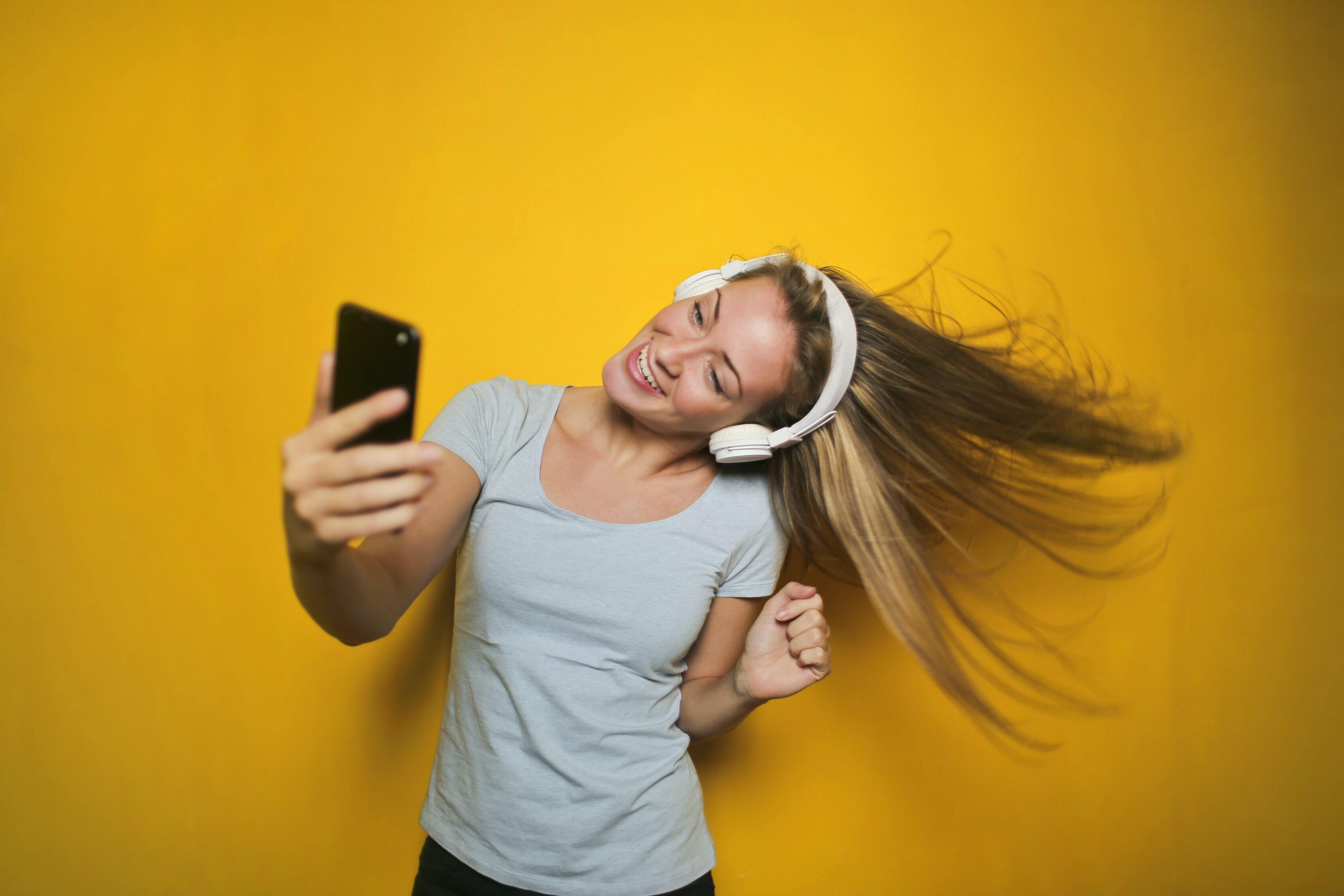 Girl dancing with headphones