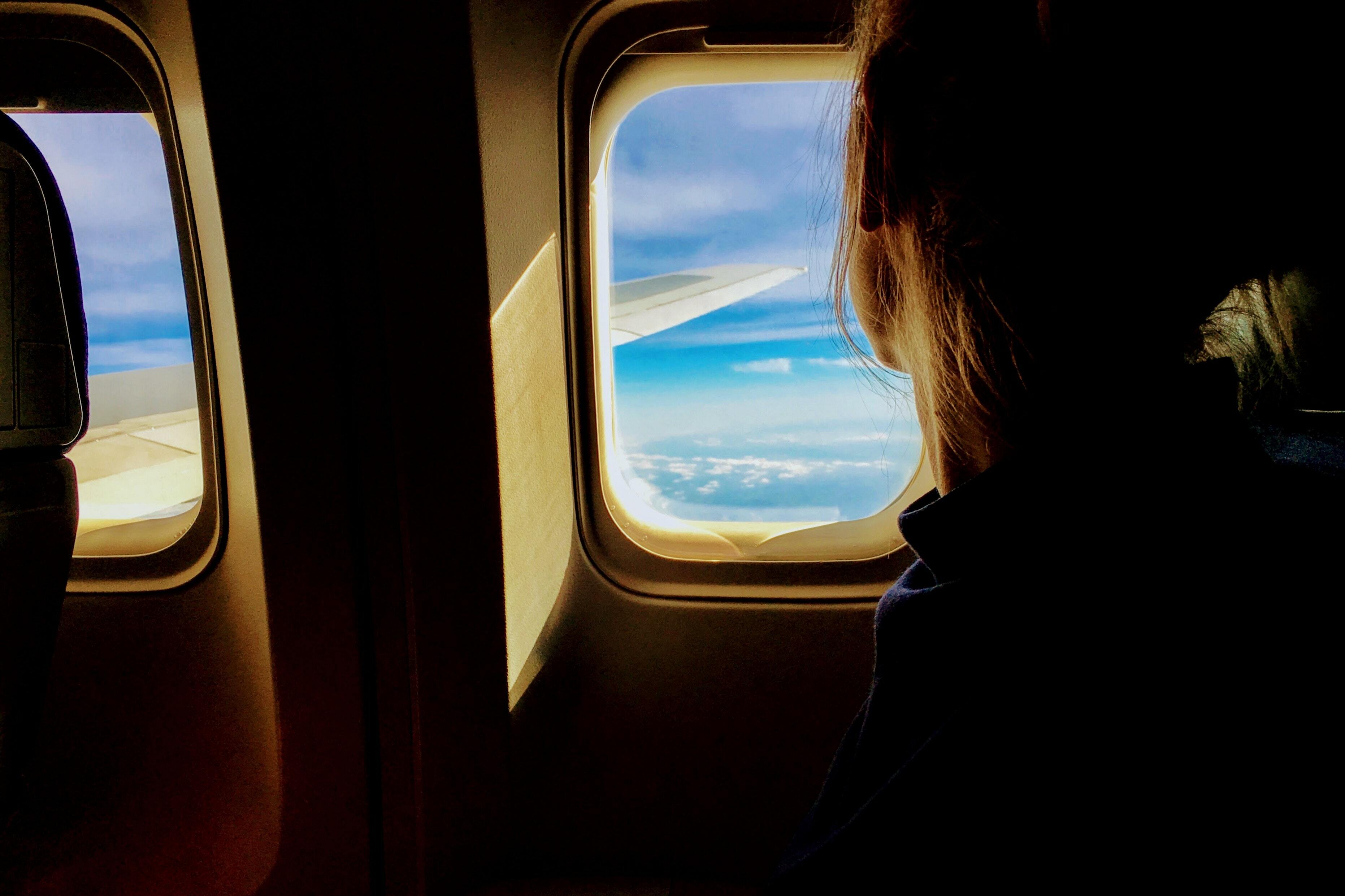 Person looking out of plane window