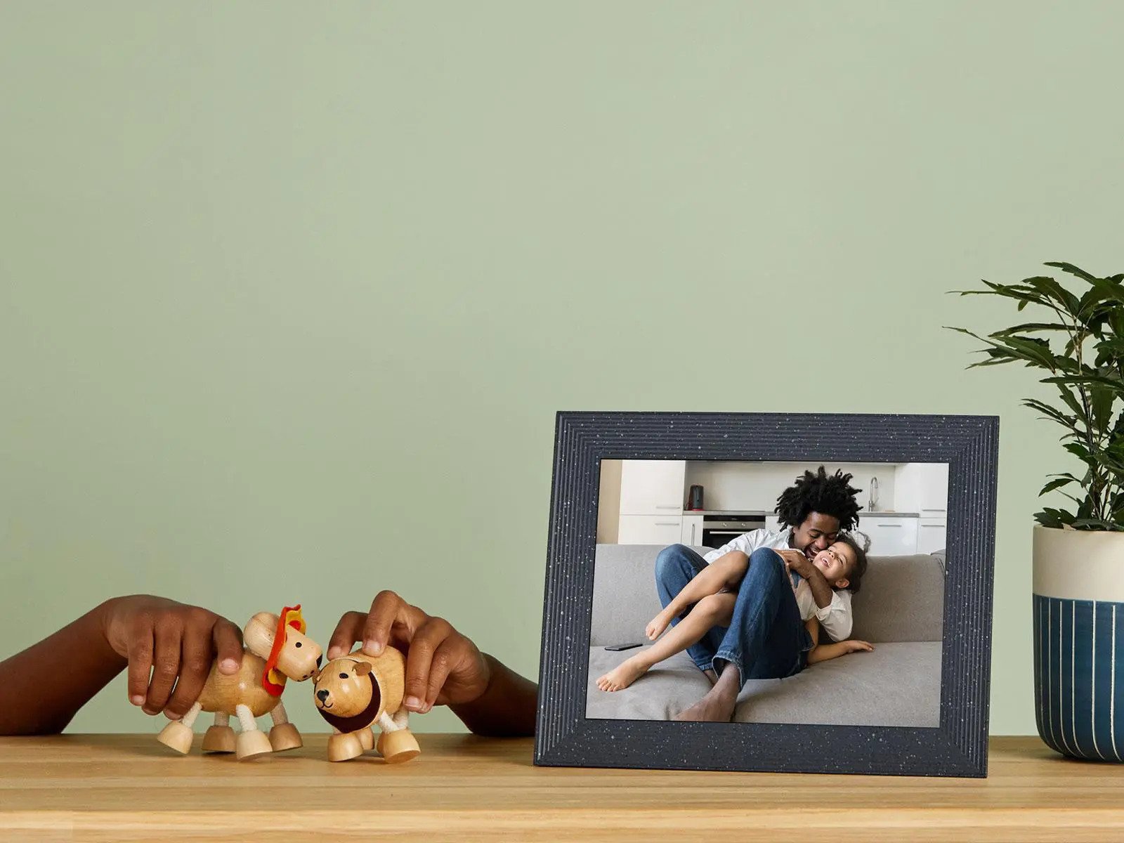 A photo frame displaying a father hugging his child
