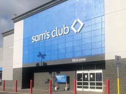 A Sam's Club location with white letters on a blue sign.