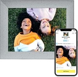 A digital photo frame with an image of smiling people