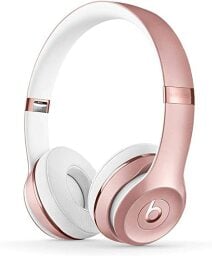 A pair of rose gold headphones from Beats