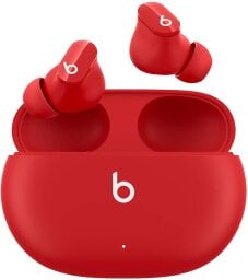 red beats studio buds in their charging case