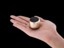 Person holding the Little Wonder Solo Stereo Multi Connect Bluetooth Speaker.