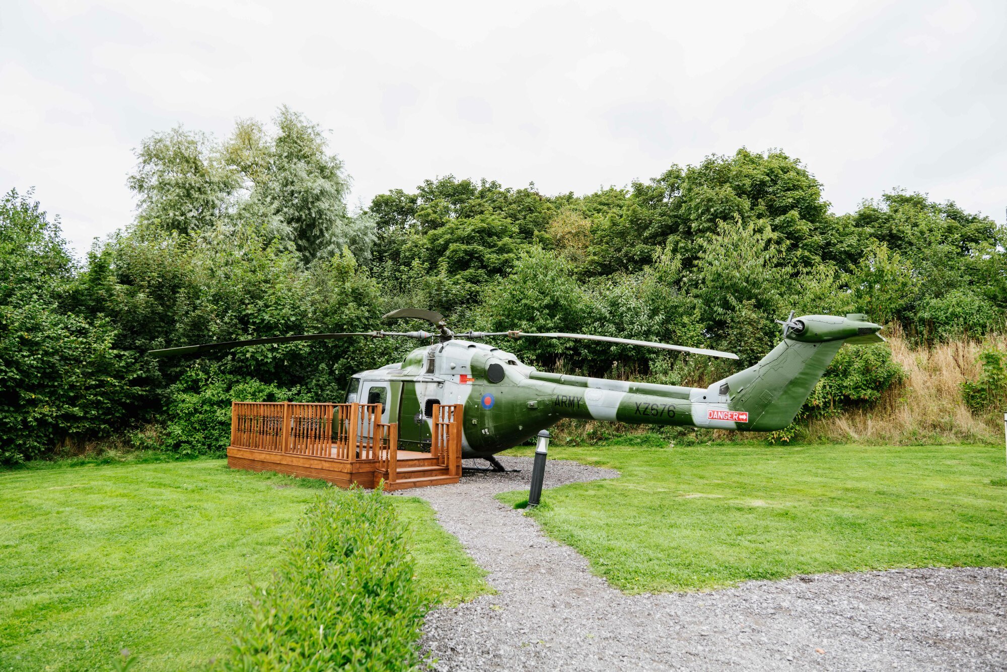 Airbnb listing of a helicopter in a field