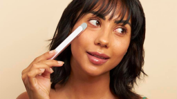 Person using SolaWave skincare wand on face