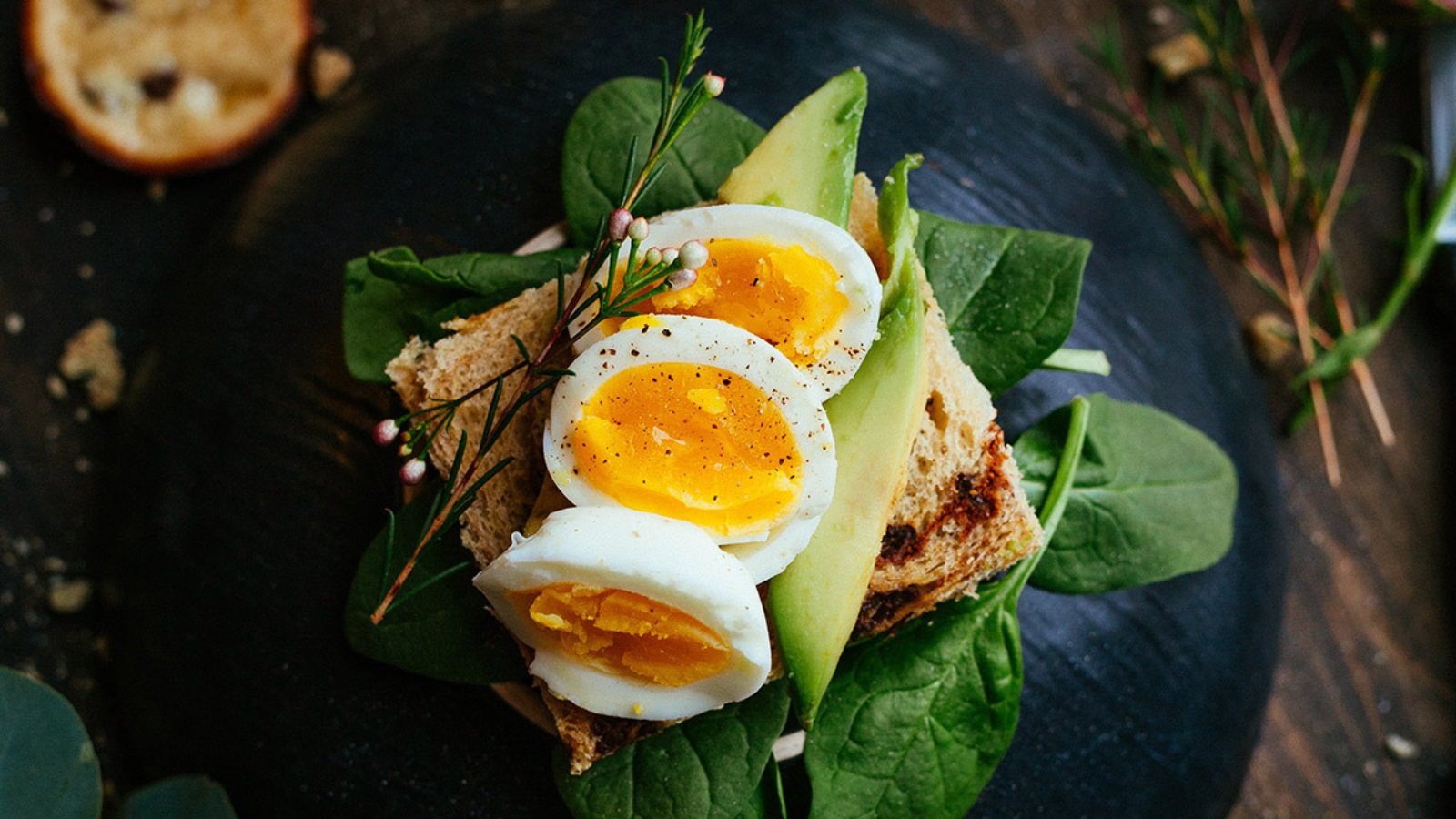 meal with eggs avocado and toast