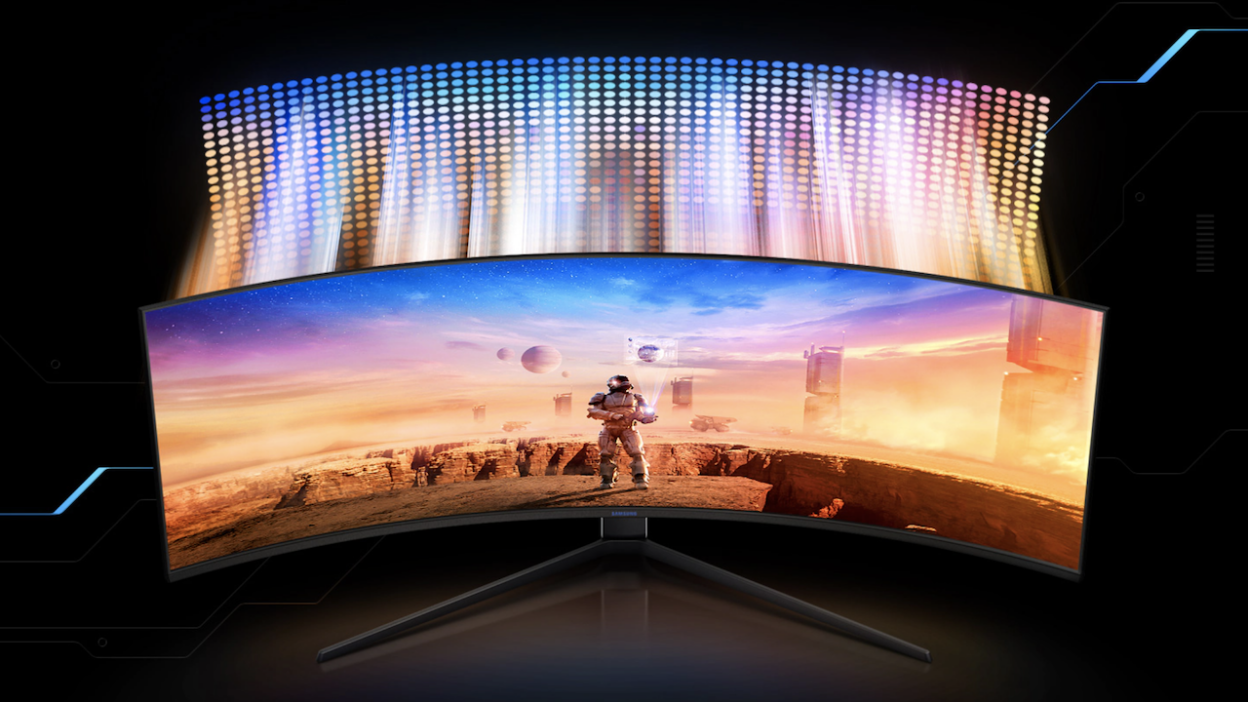 A wide gaming monitor is displaying an astronaut.