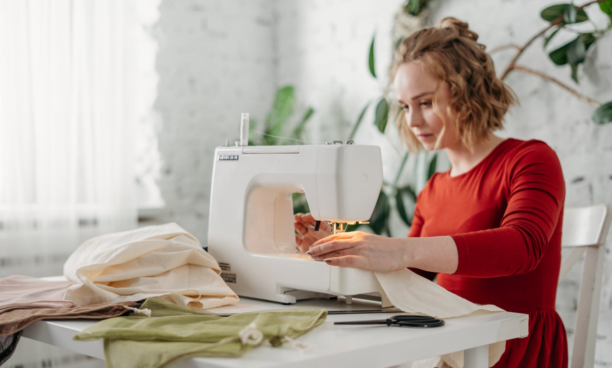 a woman working at a sewing machine