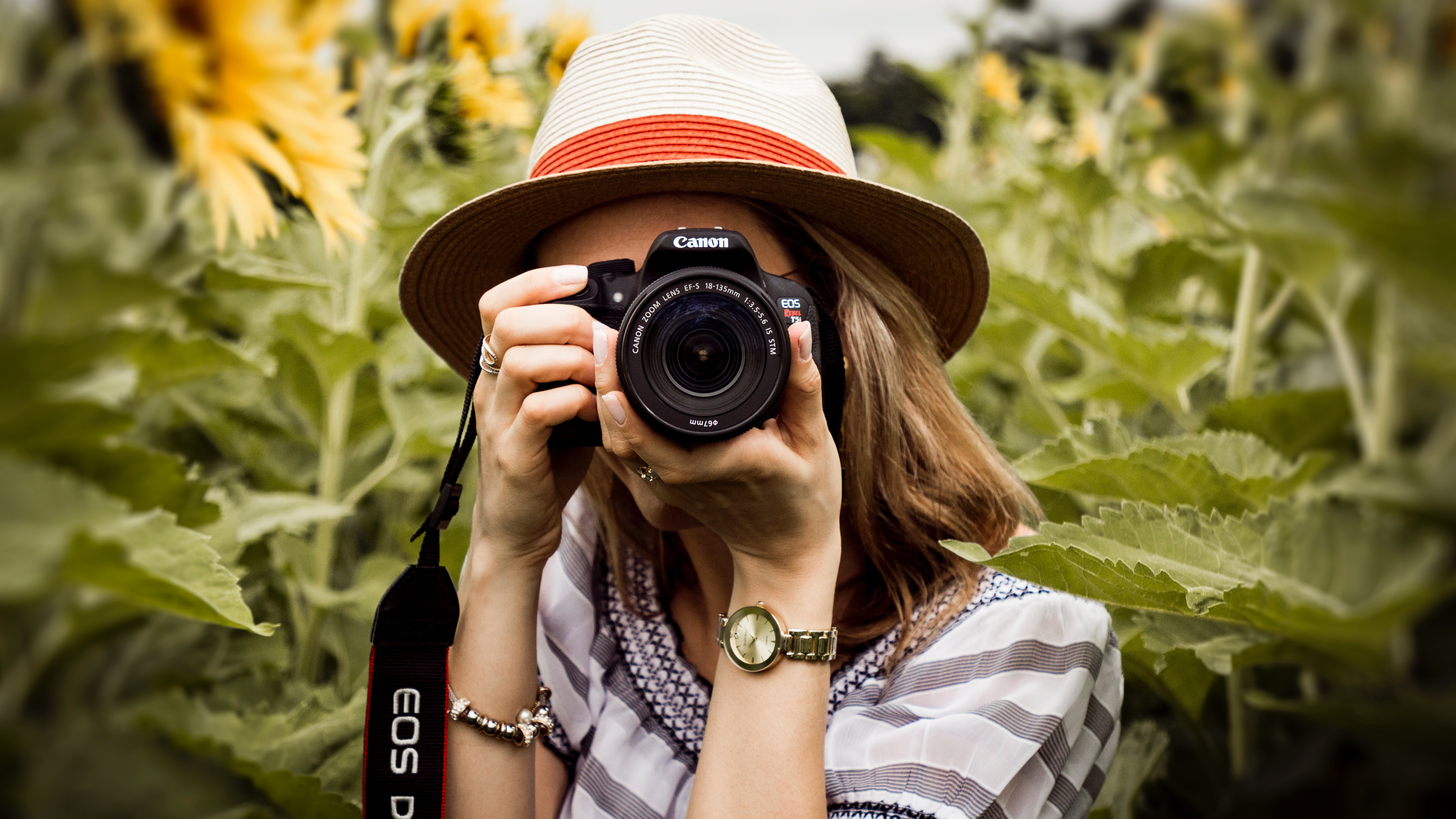 woman taking a photo with a camera