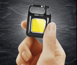hand holding maxlight utility flashlight