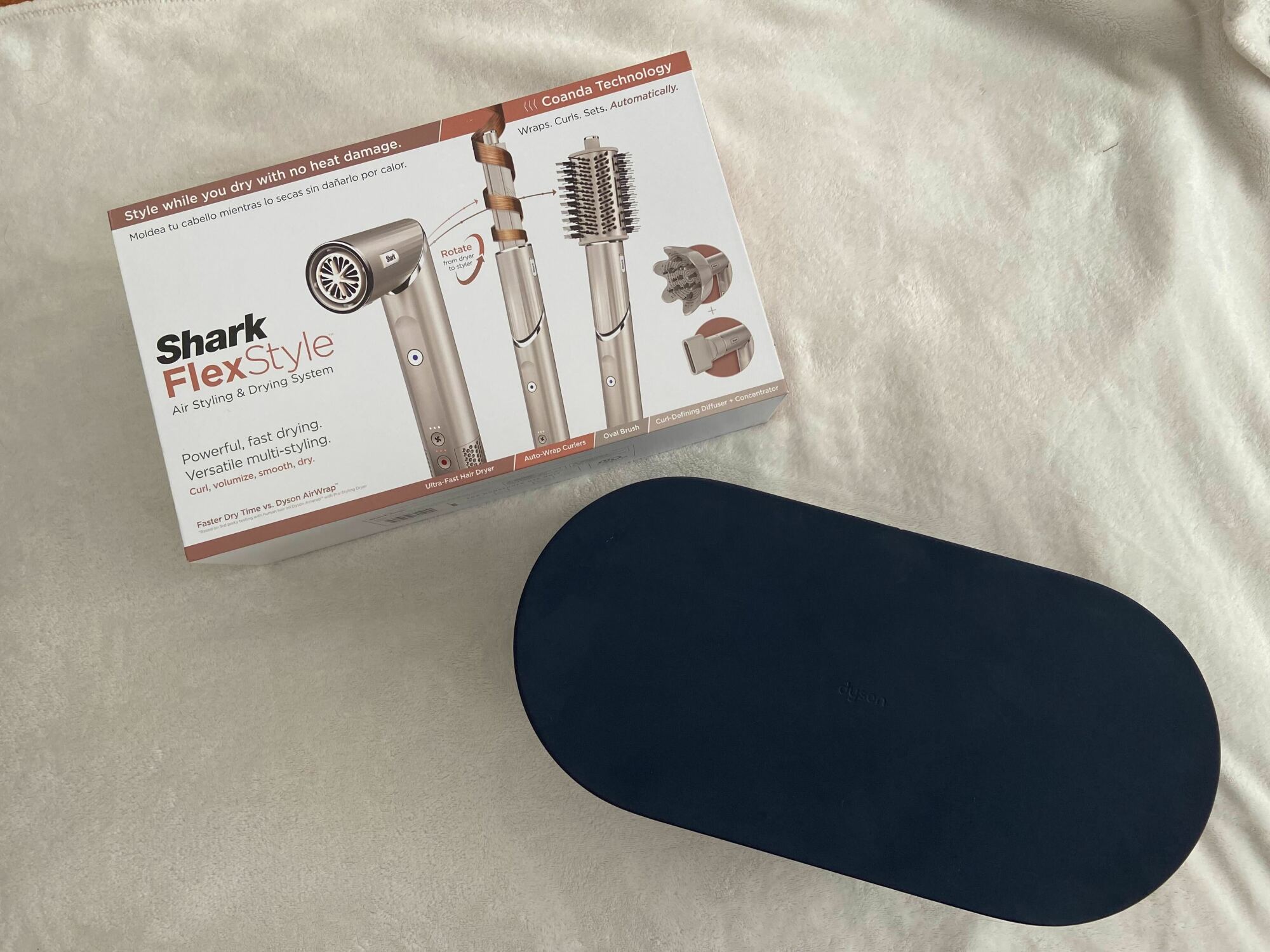 shark flexstyle box next to dark blue dyson airwrap case