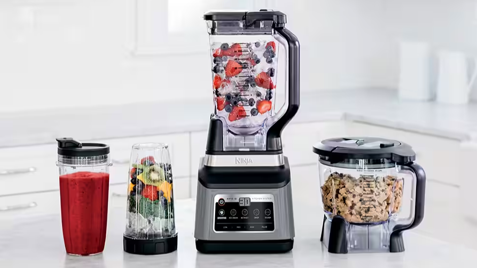 Ninja personal blenders left and center left, regular blender center right, smaller blender jar right against white kitchen