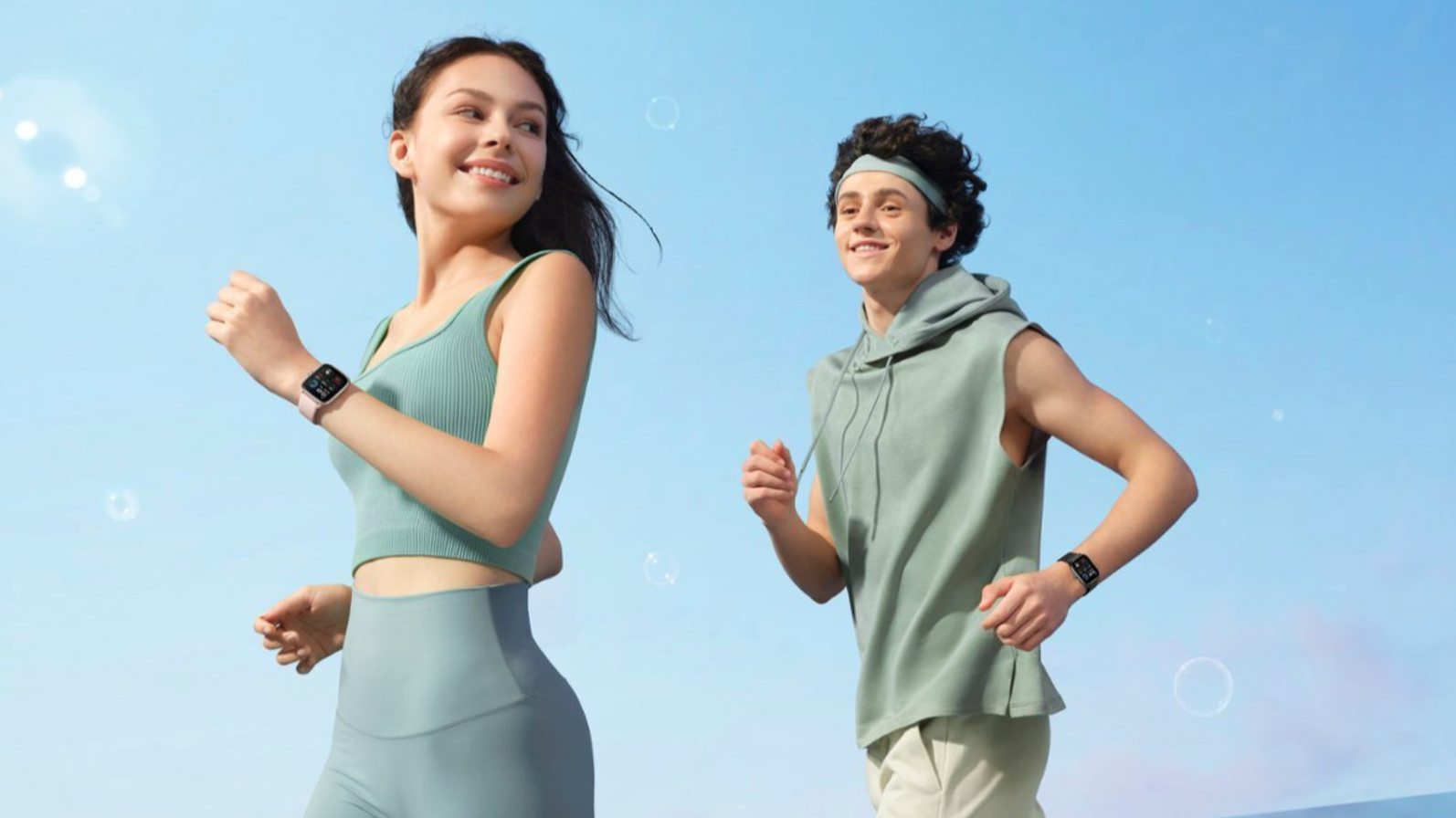 Woman and man in blue workout gear with Amazfit watches