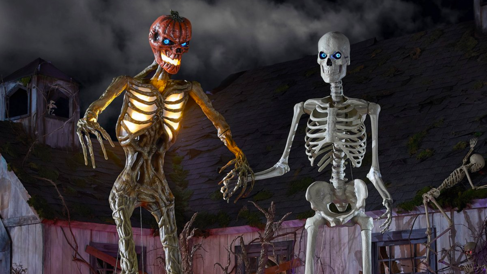 home depot's inferno pumpkin skeleton and original 12-foot skeleton against a spooky backdrop