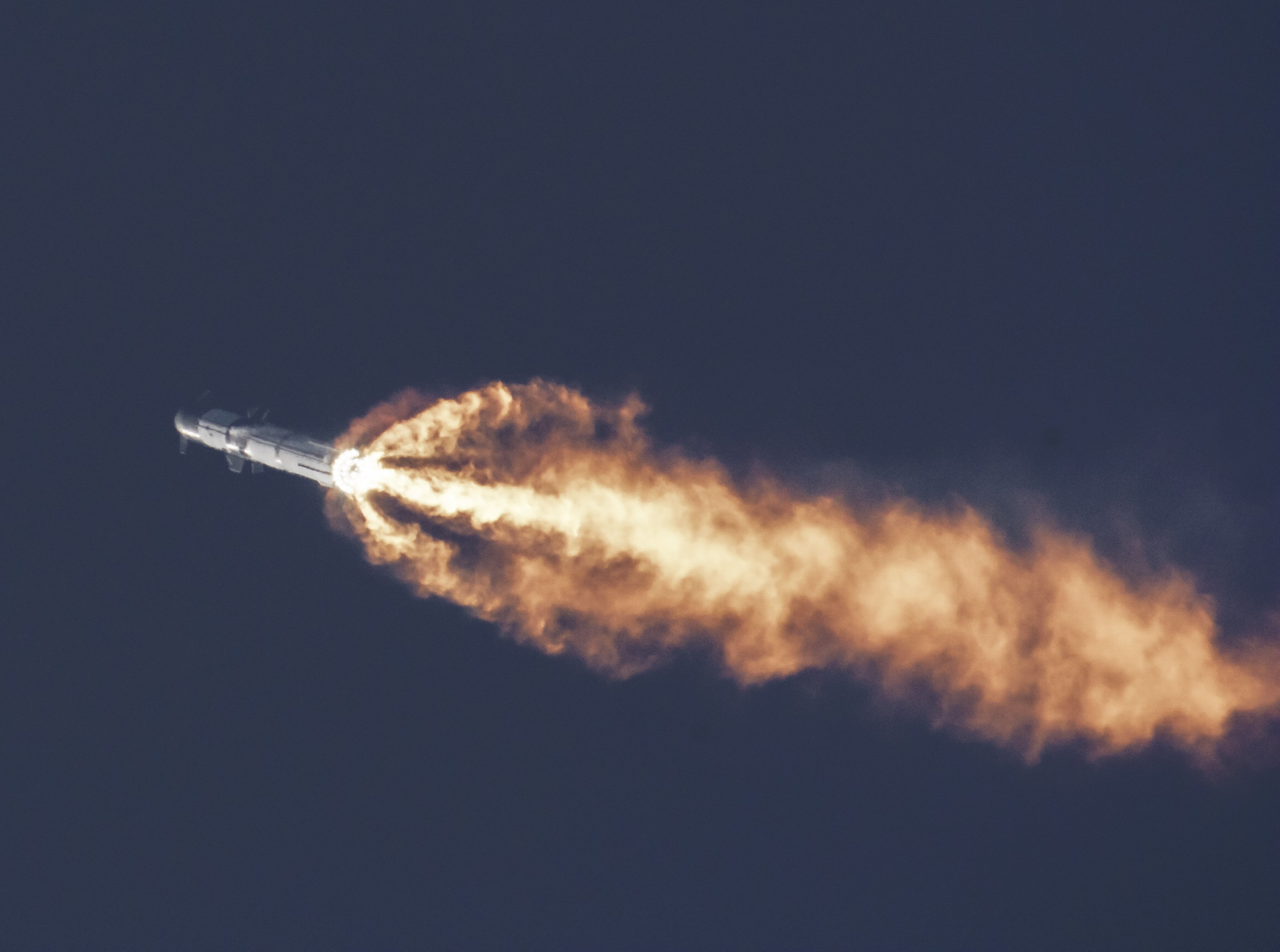 Starship flying through the sky