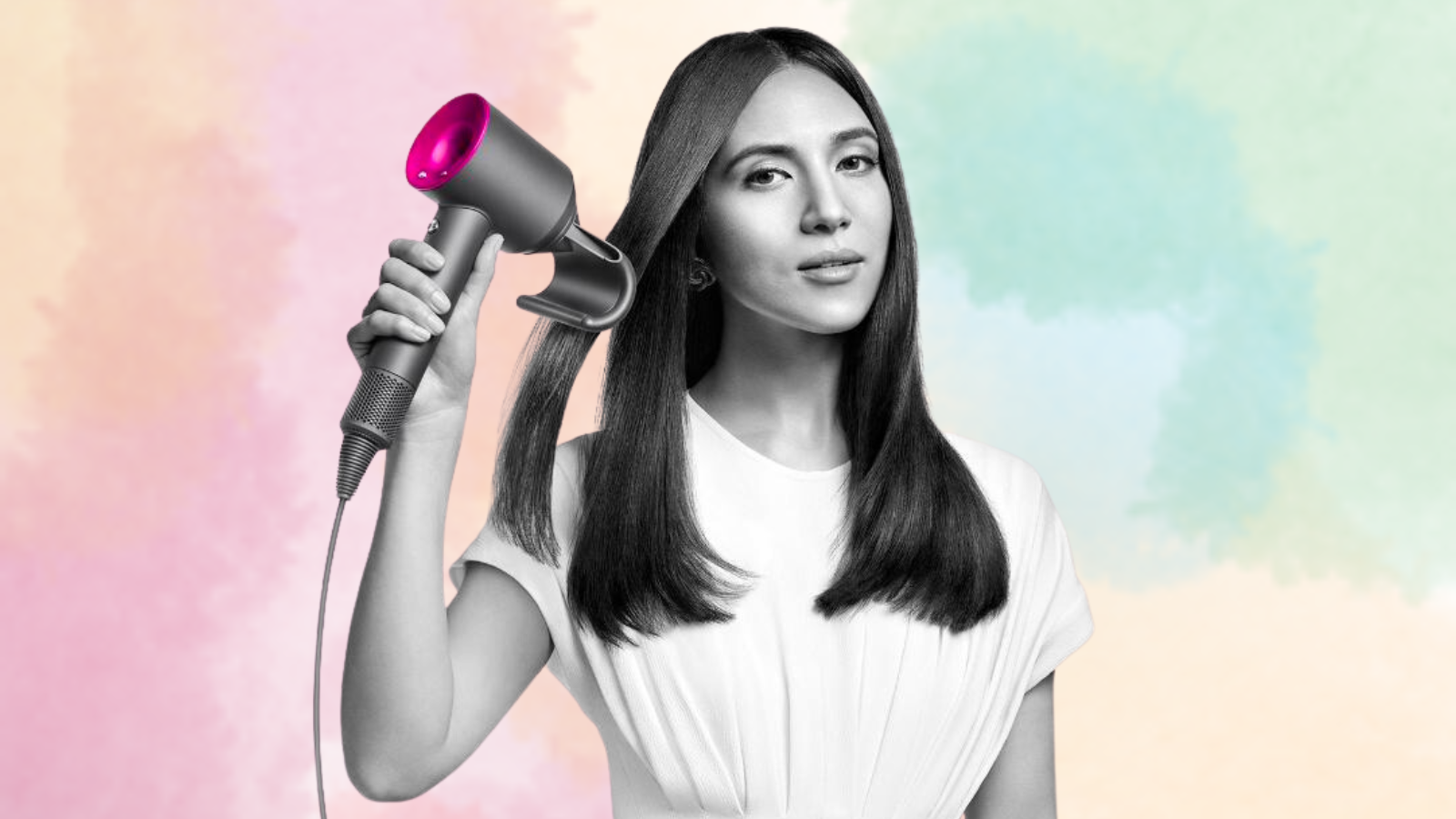 Woman using Dyson Supersonic hair dryer on pastel background
