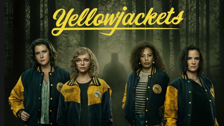 Four women in Yellow jackets against a forest background, 