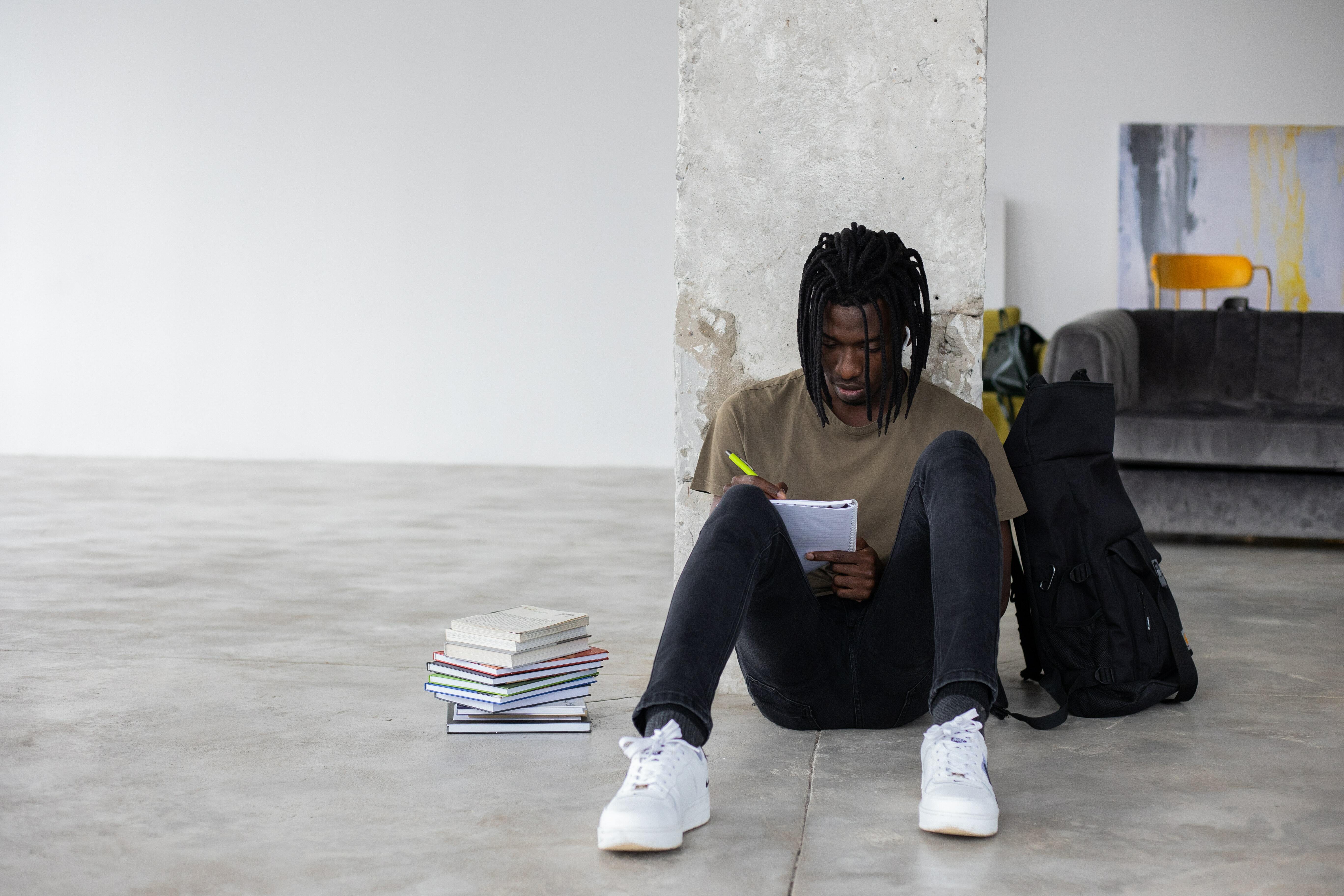 Student sitting on floor