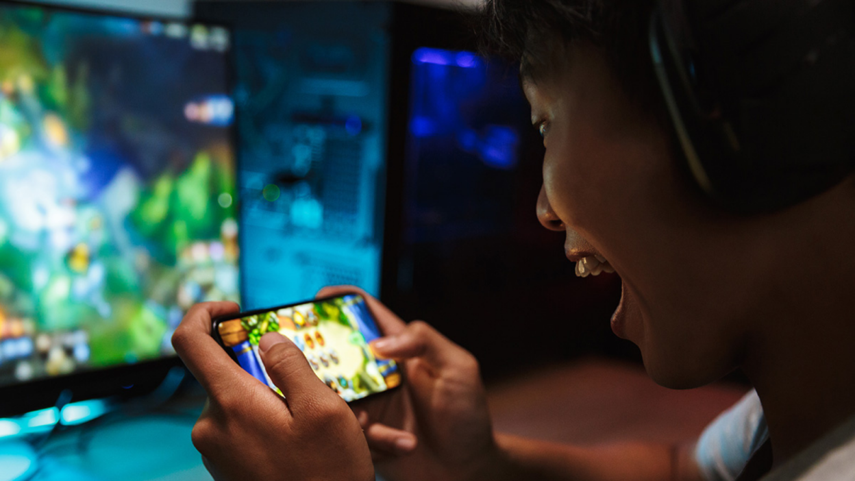 Boy playing a game in hands