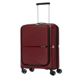 Wine-colored hard luggage against a white background