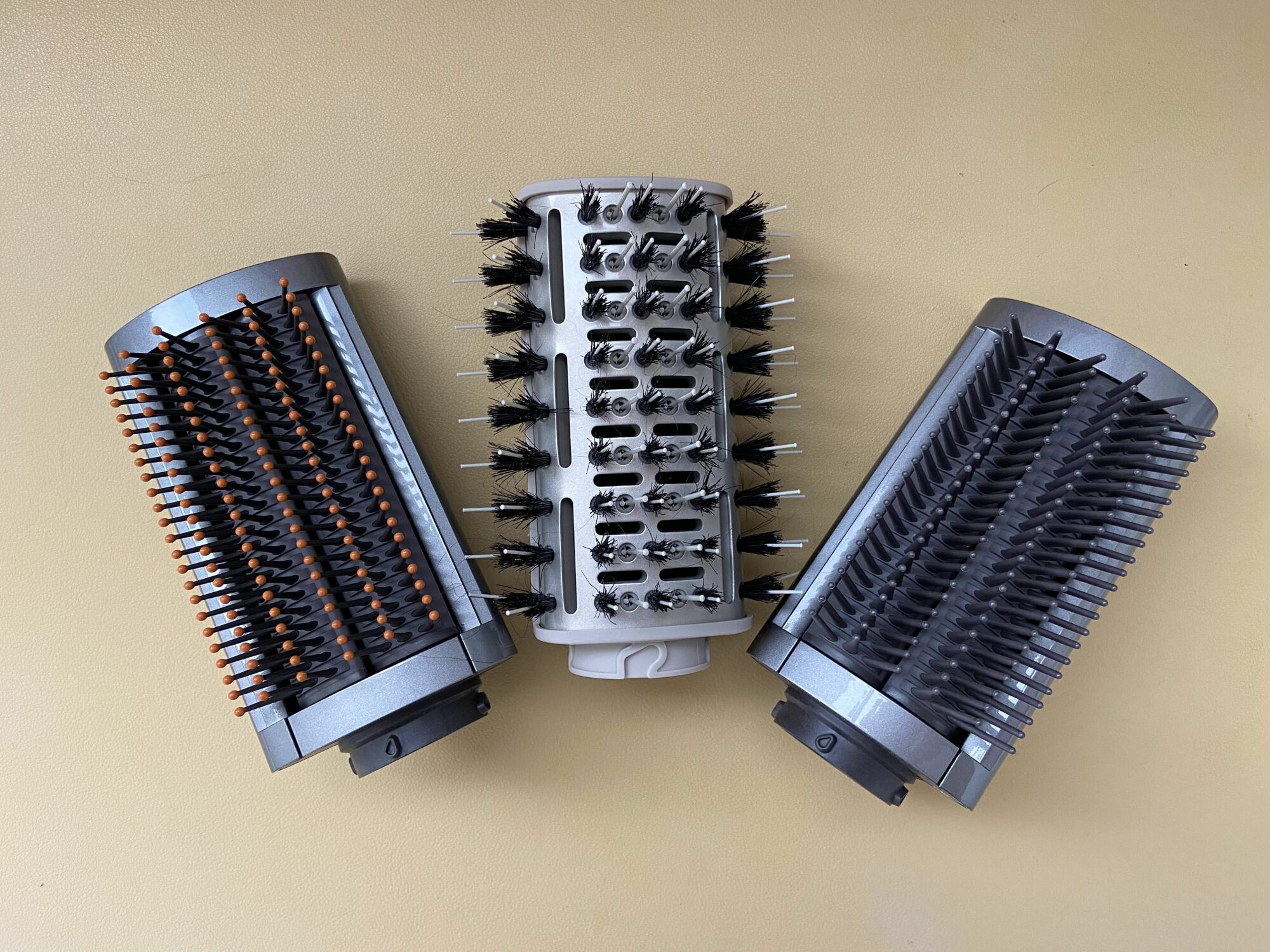 dyson's two smoothing brushes on either side of the shark smoothing brush