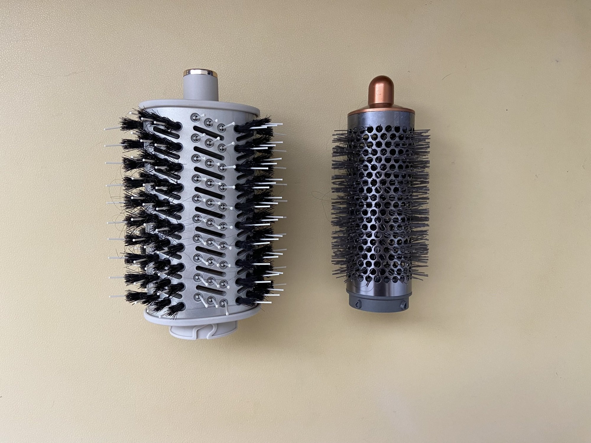shark flexstyle oval brush next to dyson round brush