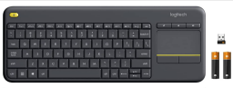 black wireless keyboard with receiver on top right and 2 batteries on bottom right