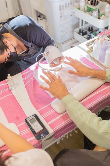 Manicurist doing Eric's Nails