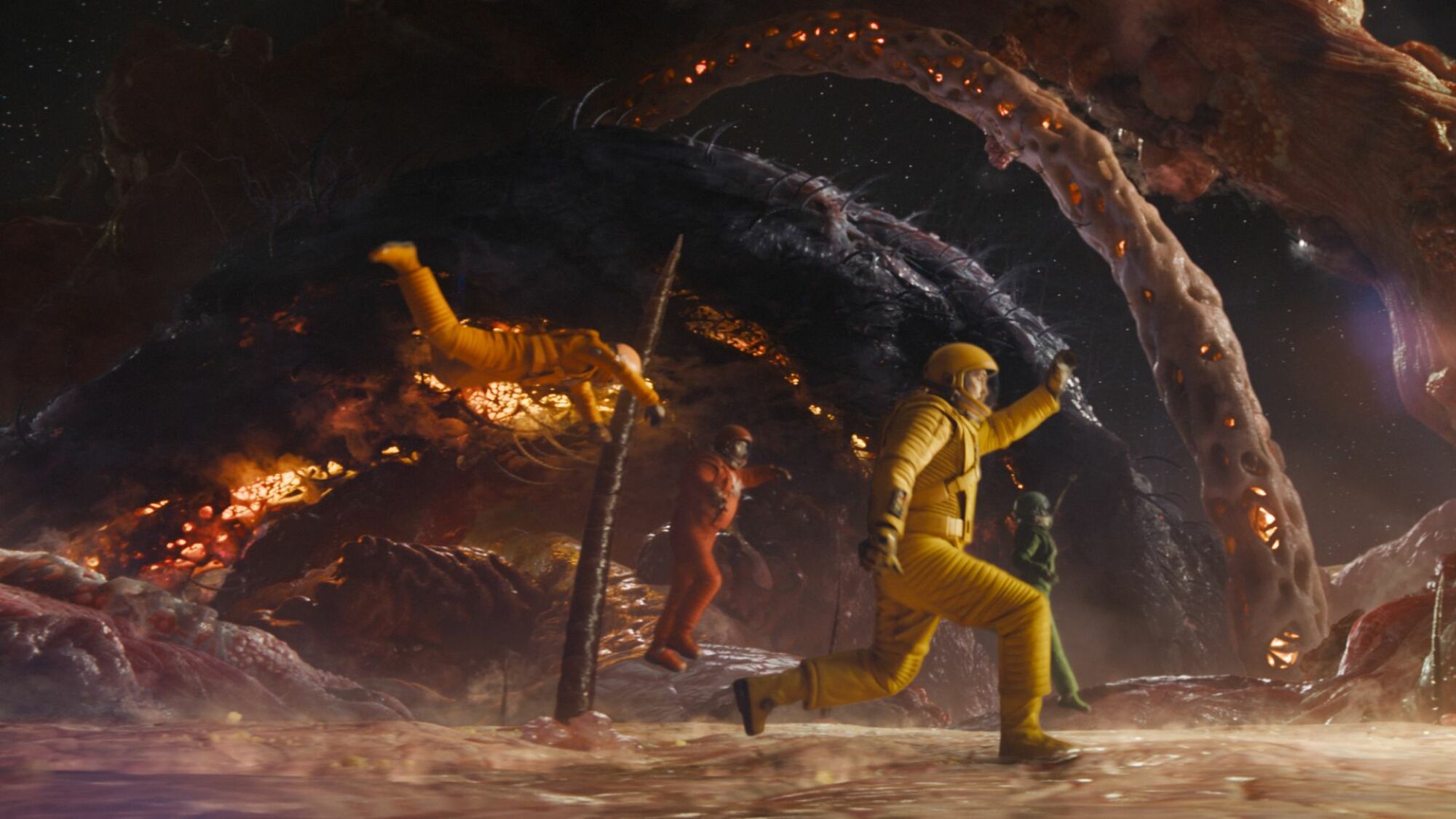 Guardians running in colorful spacesuits