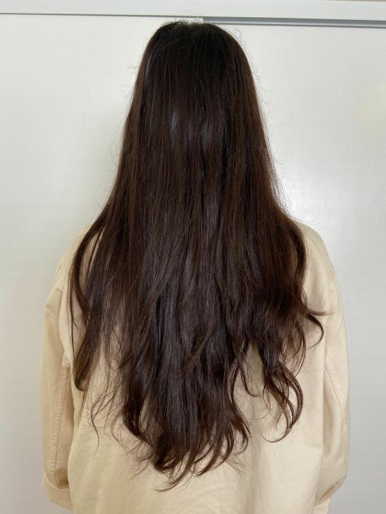 woman with long, mostly straight styled hair