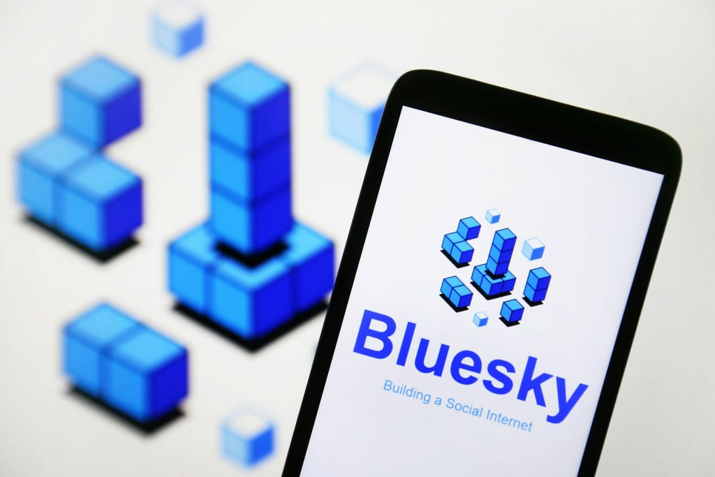 BlueSky social logo on phone screen
