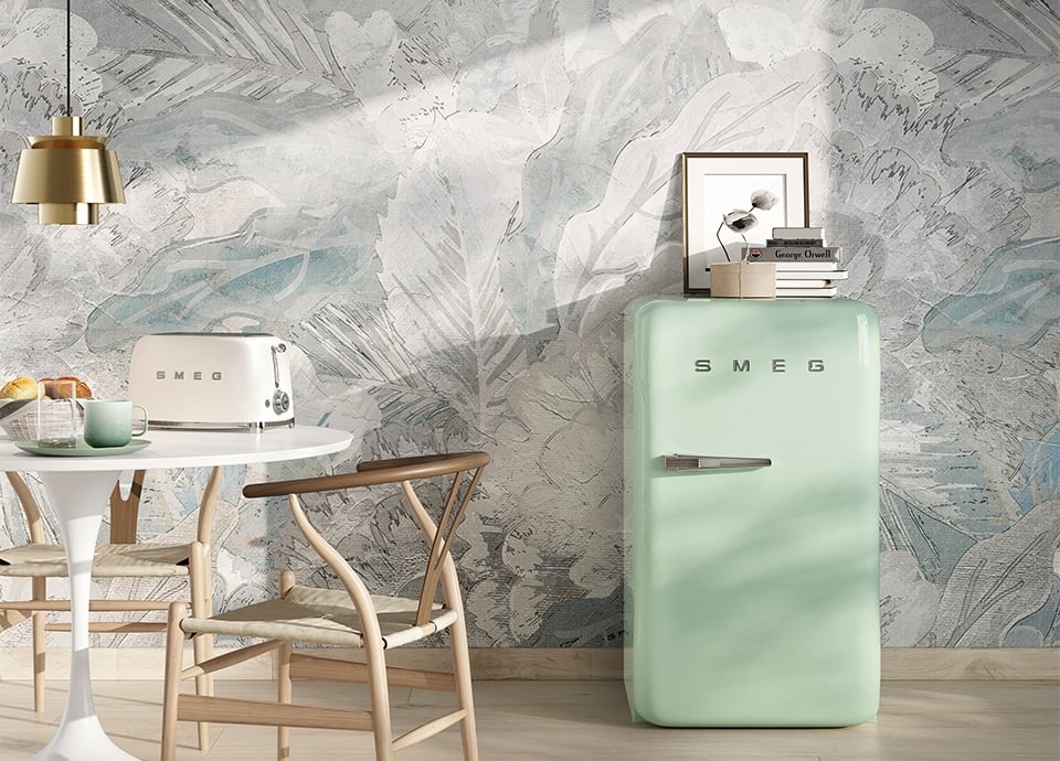 Smeg FAB10 fridge in a kitchen next to a Smeg toaster, kitchen table, lamp, and more items.