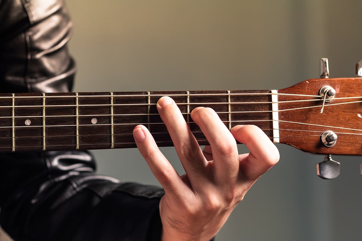 Person playing guitar.