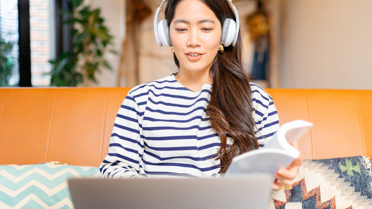 Woman looking at laptop