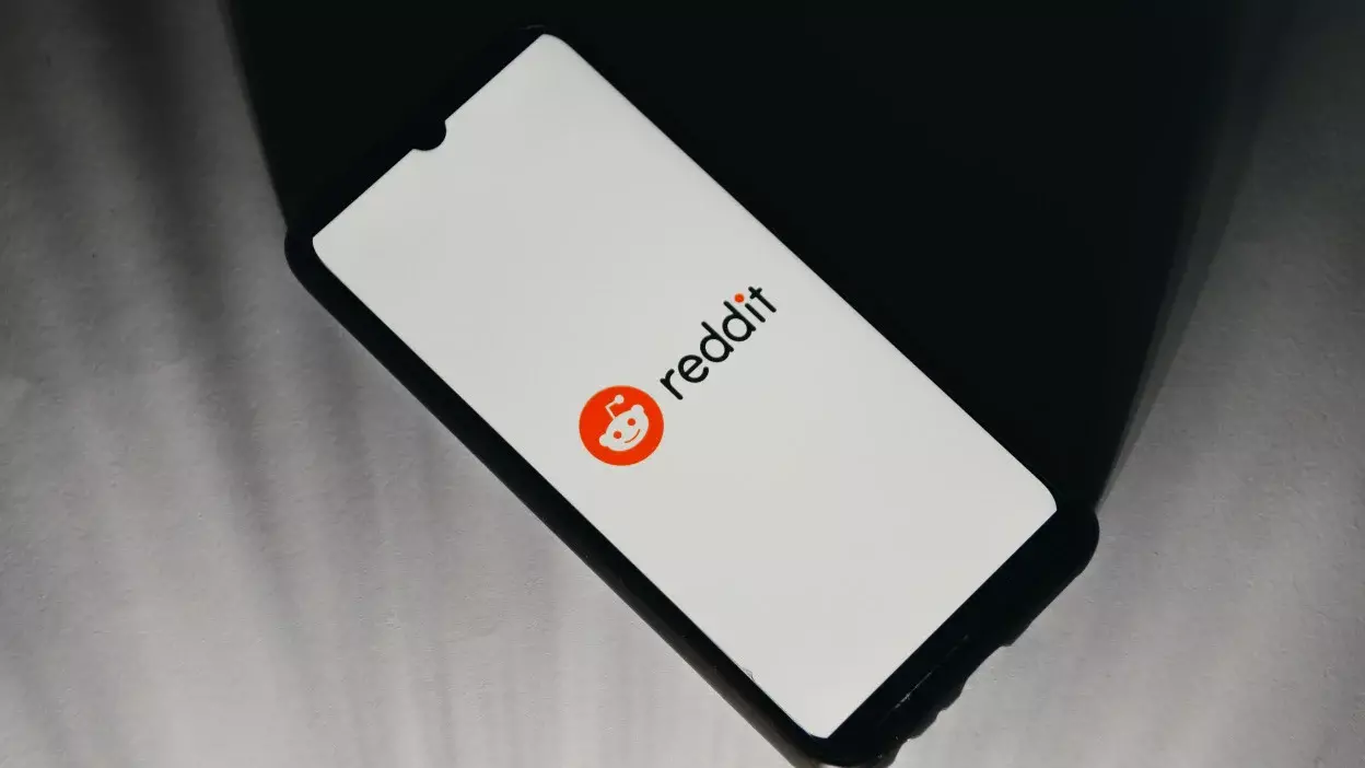 A Reddit logo on a phone.