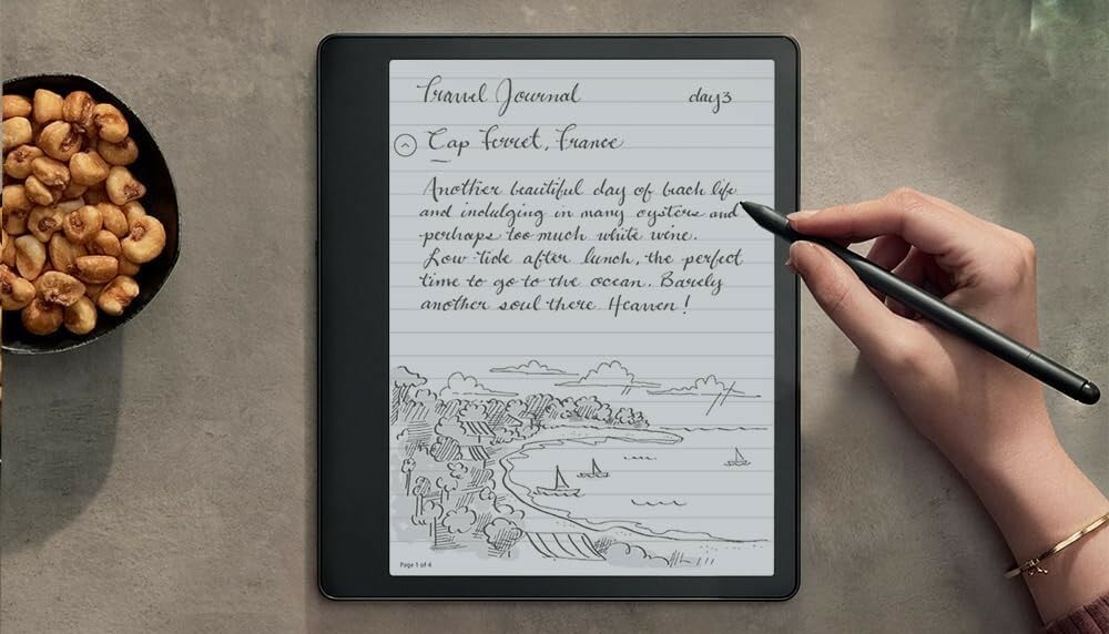 a right hand writes on the kindle scribe with the included pen
