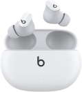 a pair of white beats studio buds earbuds on a white background with their included case