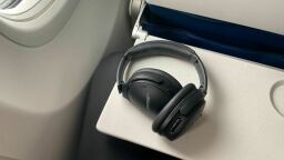 bose 45 headphones on airplane backseat tray