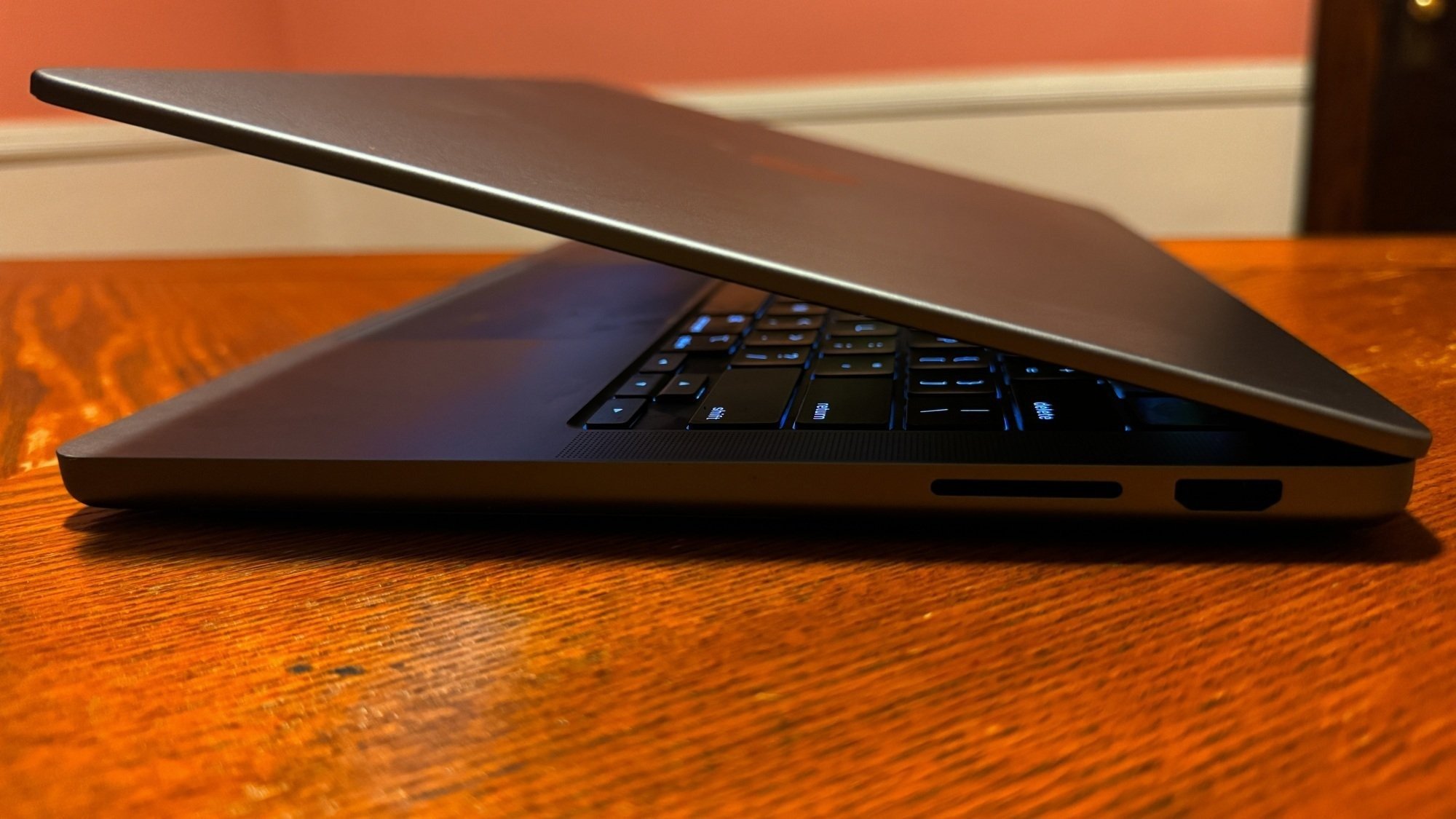 M3 MacBook Pro on a table showing the side