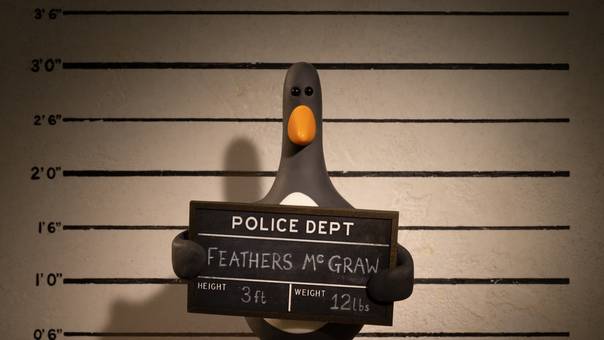 Feathers McGraw gets his mugshot taken.