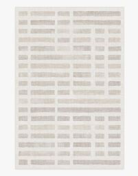 A rug appears with an ivory pattern of light blocks.