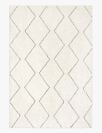A zigzag pattern of black lines appears on a white rug.