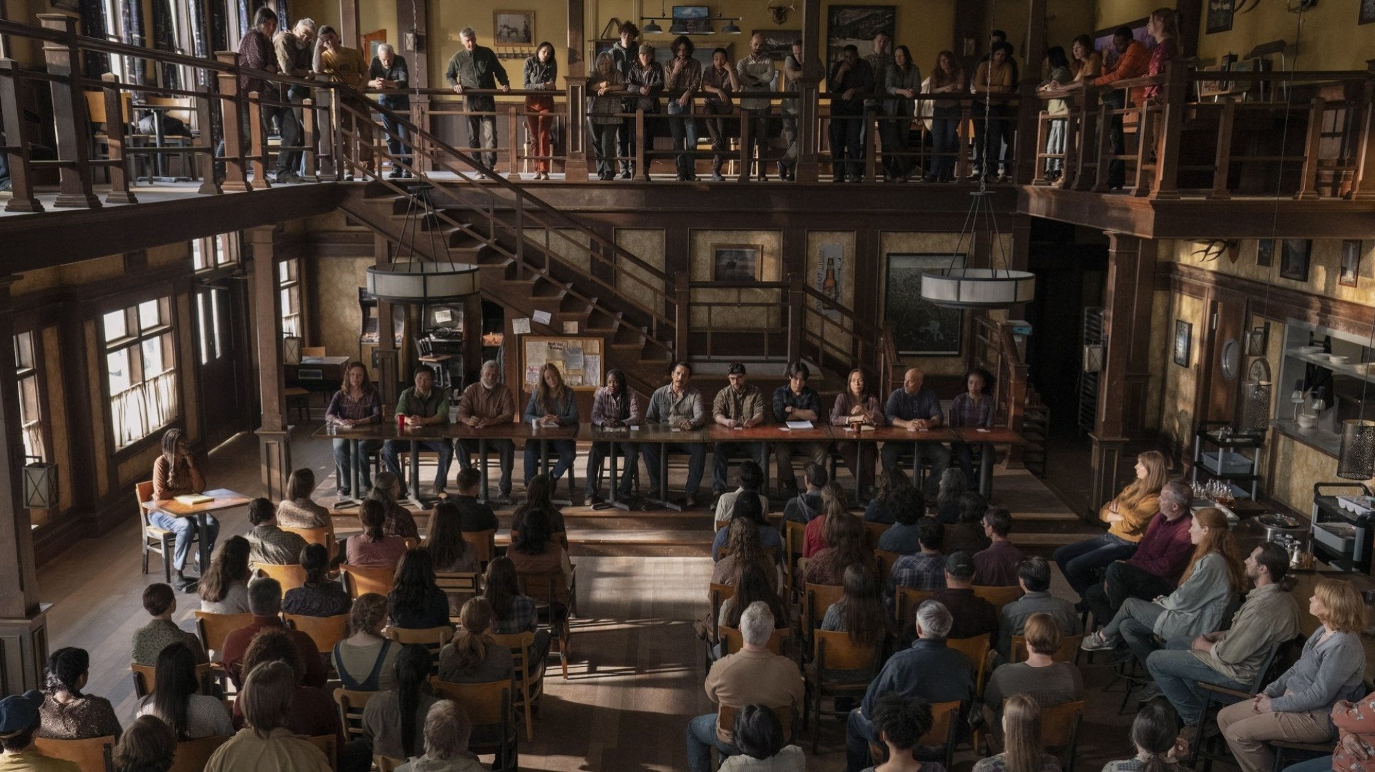 A town meeting full of people, seen from above, in "The Last of Us."