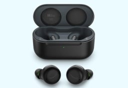 amazon echo buds with anc laying next to open case