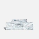 a set of Brooklinen sheets stacked above each other